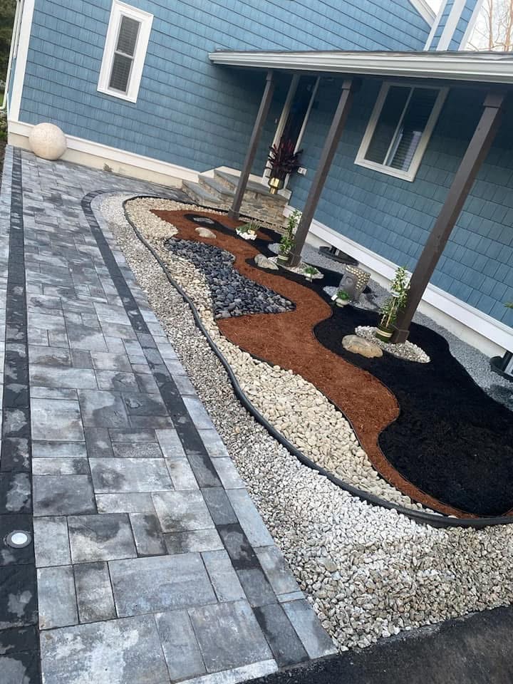 Precision hardscape design — custom paver walkway and landscape feature